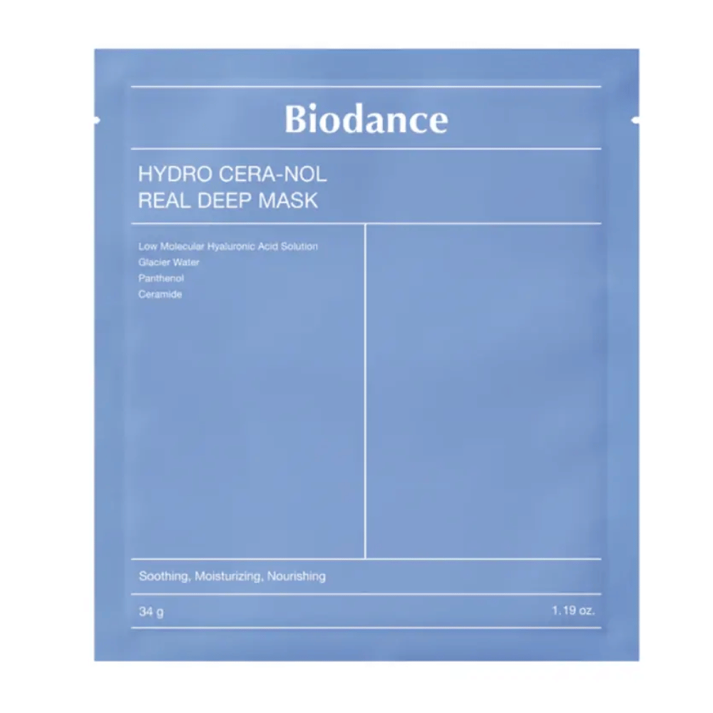 El empaque muestra "Biodance Hydro Cera-Nol Real Deep Mask". Es una mascarilla facial calmante, hidratante y nutritiva que contiene ácido hialurónico de bajo peso molecular, agua glaciar, pantenol y ceramidas. El diseño es sencillo en un tono azul calmante.